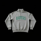 A light gray heathered quarter-zip sweatshirt with 'RAIDERS' printed in green arched block letters across the chest, displayed against a solid black background.