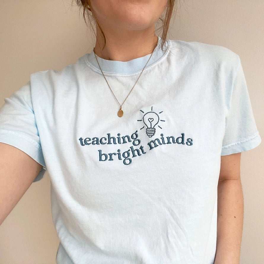 Custom “teaching bright minds” Embroidered Shirt | Choose Style, Color & Thread