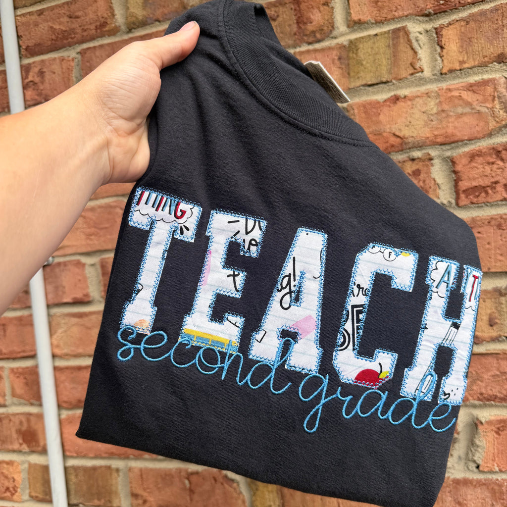 Personalized teacher appliqué shirt featuring TEACH fabric lettering with custom embroidered name underneath and customizable shirt and thread colors.