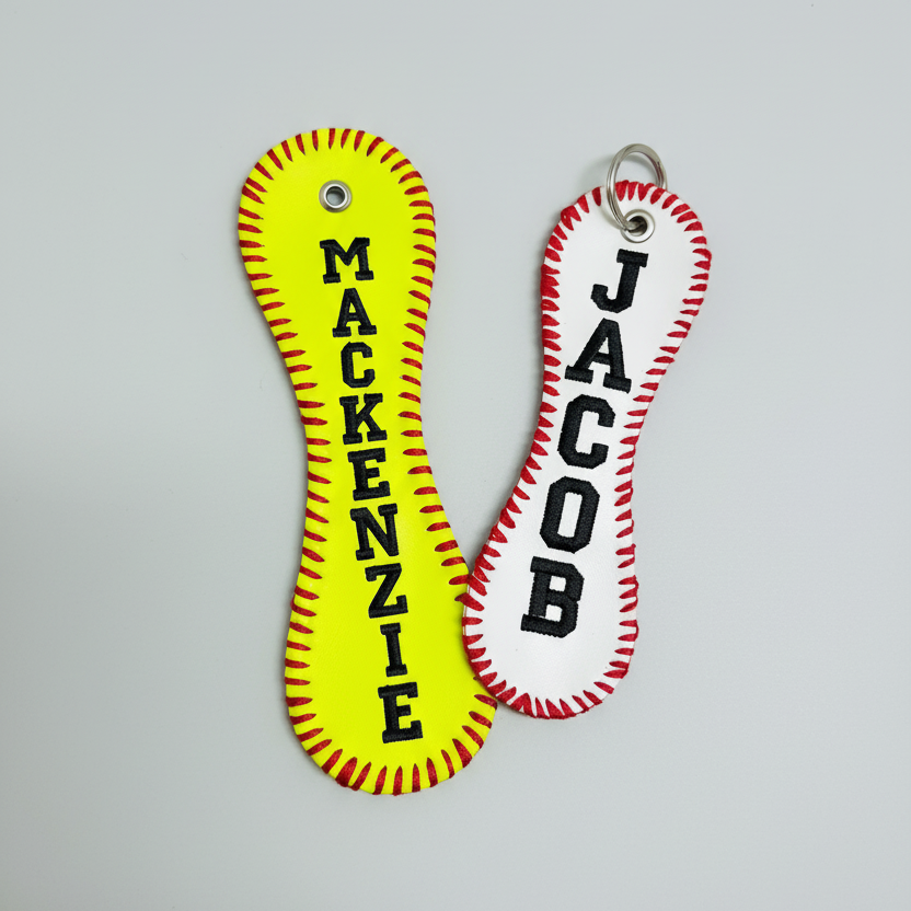 Two keychains with personalized names 'Mackenzie' and 'Jacob' on a light gray background.