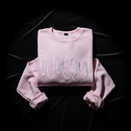 Pink sweatshirt with 'Wifey' text on a black background