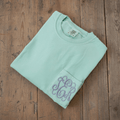 Personalized Comfort Colors pocket tee with lavender embroidered monogram on mint green shirt.